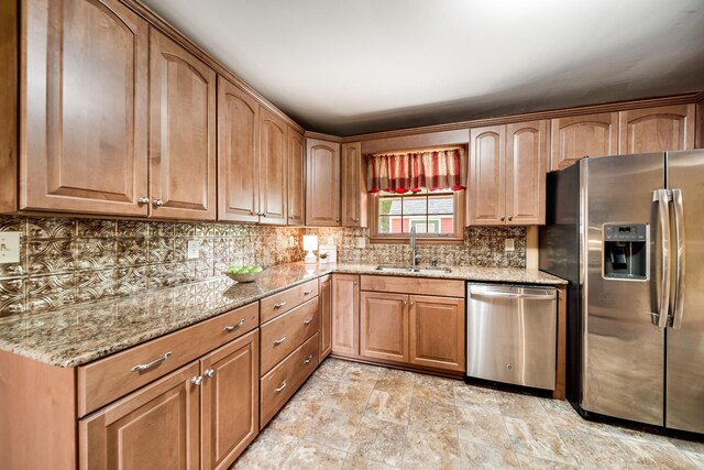 120 Donna Dr, Hendersonville, TN 37075 - kitchen with stainless steel appliances, a sink, light stone countertops, and decorative backsplash