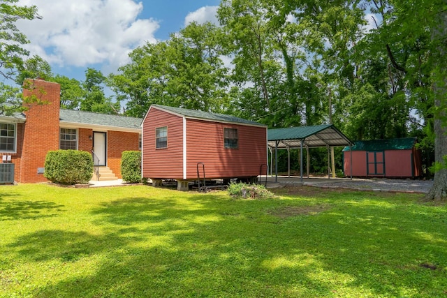 120 Donna Dr, Hendersonville, TN 37075 - rear view of property featuring a lawn, a carport, entry steps, roof with shingles, and a chimney