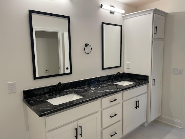 693 Eva Agnes, Clarksville, TN 37042 - bathroom featuring double vanity and baseboards