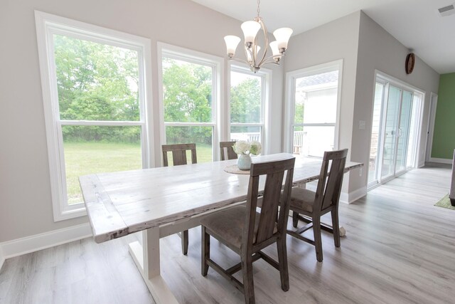 222 Preacher Roberson Rd, Castalian Springs, TN 37031 - dining room with a chandelier, baseboards, and light wood-style floors