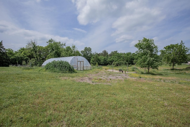 222 Preacher Roberson Rd, Castalian Springs, TN 37031 - view of grassy yard with an exterior structure and an outbuilding