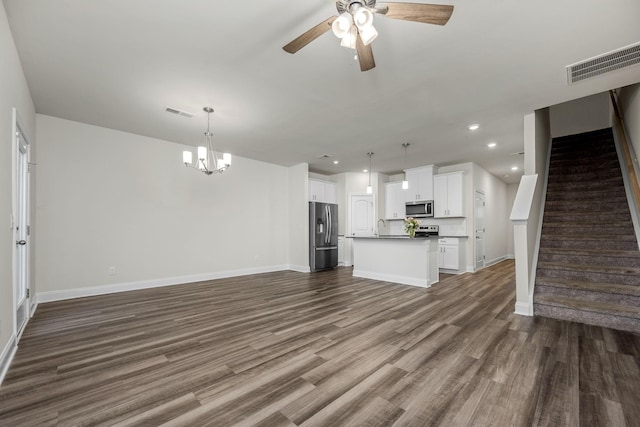 818 Arrington Way, Columbia, TN 38401 - unfurnished living room featuring ceiling fan, baseboards, a chandelier, dark wood-style floors, and a sink
