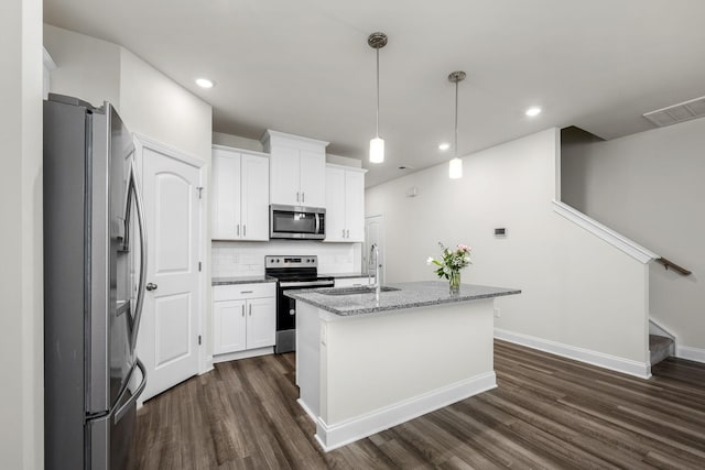 818 Arrington Way, Columbia, TN 38401 - kitchen with stainless steel appliances, dark wood-style flooring, a sink, white cabinetry, and recessed lighting