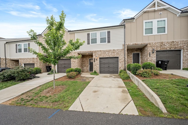 818 Arrington Way, Columbia, TN 38401 - multi unit property featuring brick siding, concrete driveway, board and batten siding, and an attached garage