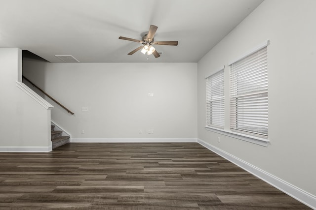 818 Arrington Way, Columbia, TN 38401 - unfurnished room featuring ceiling fan, stairs, baseboards, and dark wood-style floors