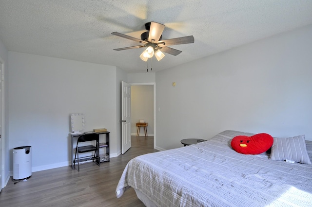 441 Bluff Dr, Clarksville, TN 37043 - bedroom featuring wood finished floors, baseboards, a ceiling fan, and a textured ceiling