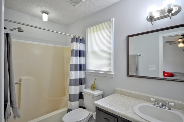 441 Bluff Dr, Clarksville, TN 37043 - bathroom with vanity, a textured ceiling, toilet, shower / bath combo with shower curtain, and a ceiling fan
