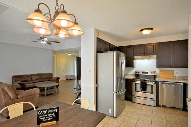 441 Bluff Dr, Clarksville, TN 37043 - kitchen with stainless steel appliances, under cabinet range hood, a ceiling fan, dark brown cabinets, and light countertops