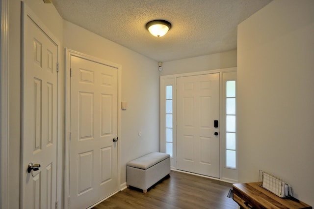 441 Bluff Dr, Clarksville, TN 37043 - foyer featuring dark wood finished floors and a textured ceiling