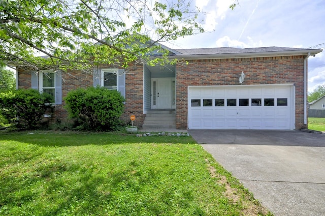 441 Bluff Dr, Clarksville, TN 37043 - view of front of house featuring concrete driveway, a front lawn, brick siding, and a garage
