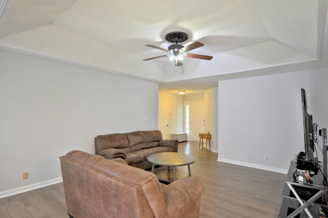 441 Bluff Dr, Clarksville, TN 37043 - living room with a ceiling fan, wood finished floors, baseboards, and a raised ceiling