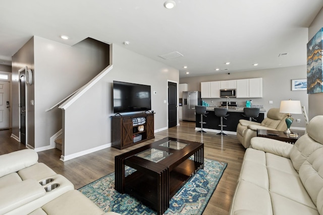 866 Long Leaf Rd, Lebanon, TN 37087 - living area featuring baseboards, dark wood-style flooring, stairway, and recessed lighting
