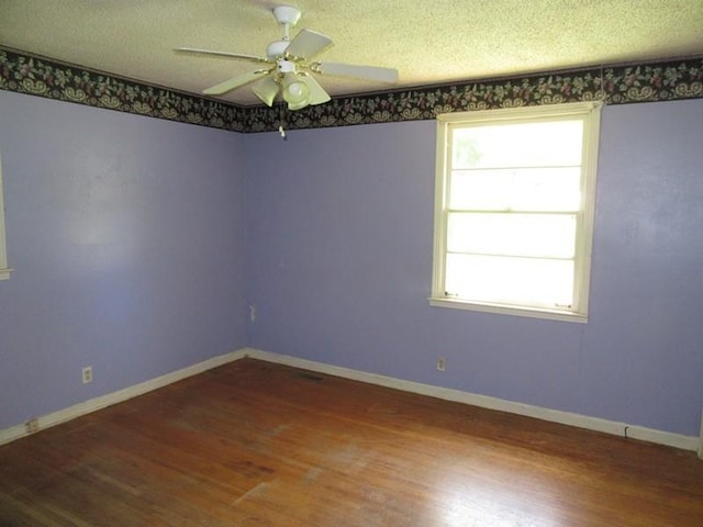 107 Jay Cir, Clarksville, TN 37040 - spare room with wood finished floors, a ceiling fan, baseboards, and a textured ceiling