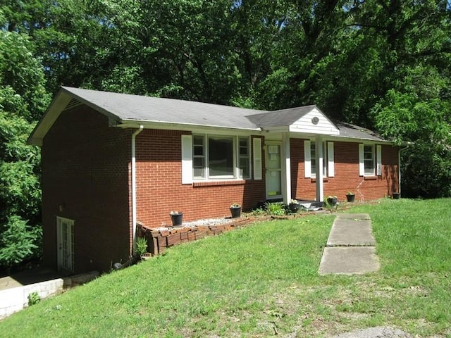 107 Jay Cir, Clarksville, TN 37040 - view of front facade with brick siding and a front lawn