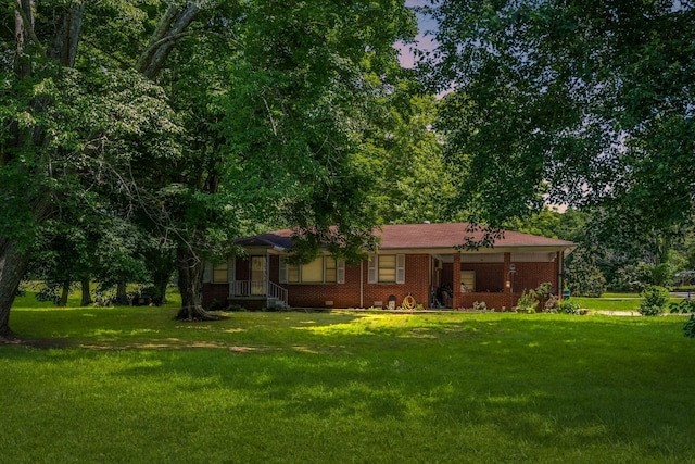 4409 Carter Dr, Nunnelly, TN 37137 - view of front of home featuring a front yard and brick siding