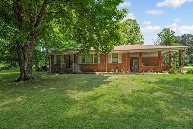 4409 Carter Dr, Nunnelly, TN 37137 - ranch-style house with a front yard, brick siding, and crawl space