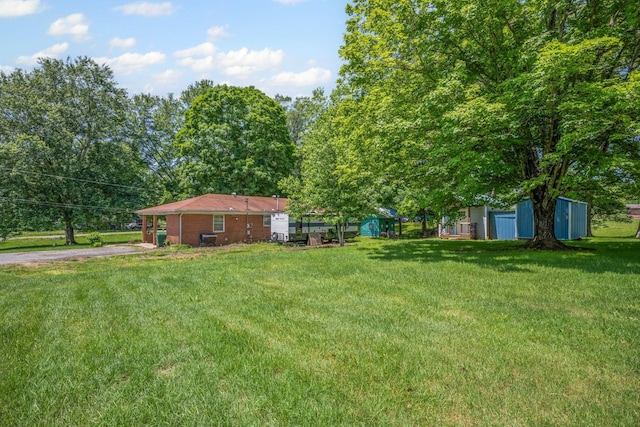 4409 Carter Dr, Nunnelly, TN 37137 - view of green lawn featuring driveway