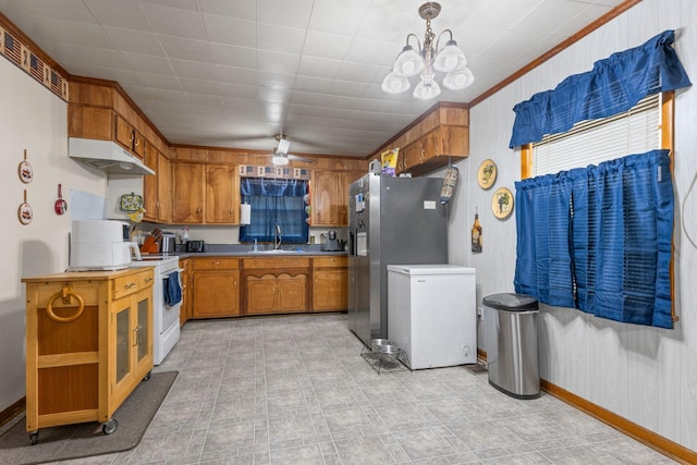 4409 Carter Dr, Nunnelly, TN 37137 - kitchen featuring white appliances, under cabinet range hood, a sink, brown cabinets, and a chandelier