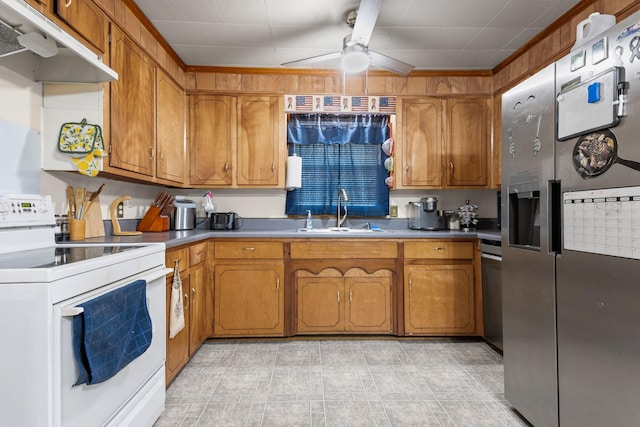 4409 Carter Dr, Nunnelly, TN 37137 - kitchen featuring electric stove, stainless steel fridge, a sink, under cabinet range hood, and brown cabinetry