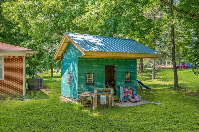 4409 Carter Dr, Nunnelly, TN 37137 - view of outdoor structure with central air condition unit and view of scattered trees