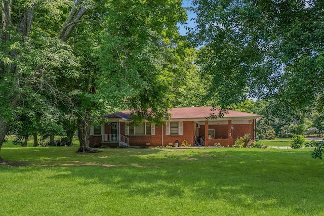 4409 Carter Dr, Nunnelly, TN 37137 - ranch-style home with a front yard and brick siding
