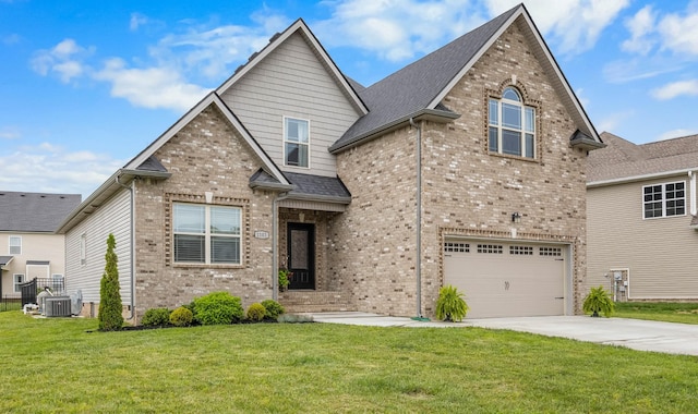 1103 Chagford Dr, Clarksville, TN 37043 - traditional home featuring brick siding, driveway, an attached garage, central AC unit, and roof with shingles