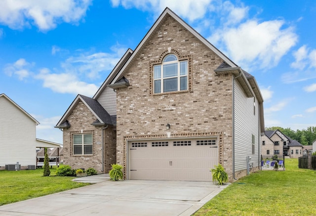 1103 Chagford Dr, Clarksville, TN 37043 - traditional-style home with an attached garage, brick siding, driveway, and central AC unit
