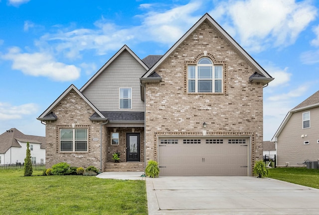 1103 Chagford Dr, Clarksville, TN 37043 - traditional-style home featuring brick siding, a front yard, concrete driveway, and a garage