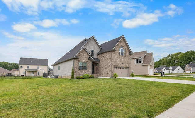 1103 Chagford Dr, Clarksville, TN 37043 - view of front of house with concrete driveway, brick siding, an attached garage, and central AC