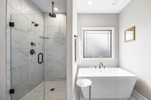 1103 Chagford Dr, Clarksville, TN 37043 - full bath with a shower stall, recessed lighting, a freestanding bath, marble look tile flooring, and baseboards