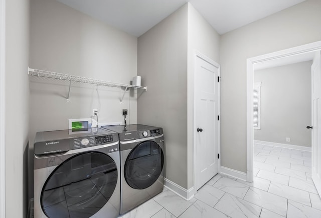 1103 Chagford Dr, Clarksville, TN 37043 - washroom with washing machine and dryer, light marble finish floors, and baseboards