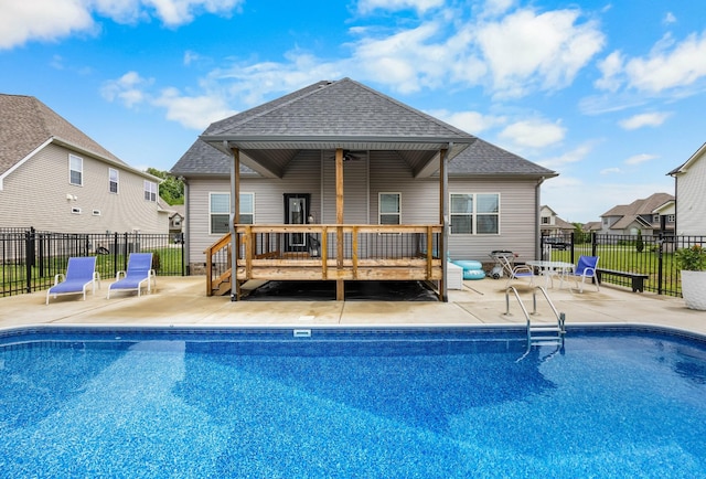 1103 Chagford Dr, Clarksville, TN 37043 - rear view of property featuring a shingled roof, a wooden deck, and a patio