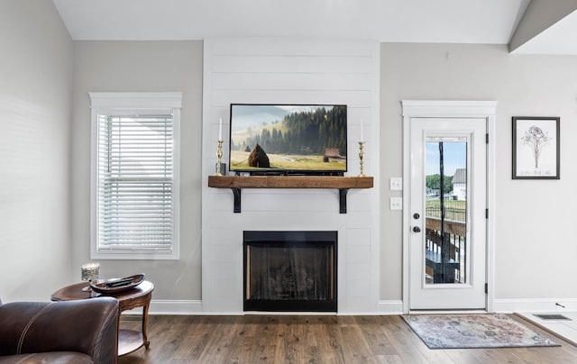 1103 Chagford Dr, Clarksville, TN 37043 - living room featuring a fireplace, wood finished floors, and baseboards