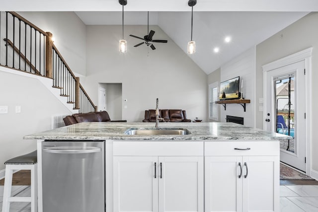 1103 Chagford Dr, Clarksville, TN 37043 - kitchen featuring open floor plan, a sink, dishwasher, ceiling fan, and light stone counters