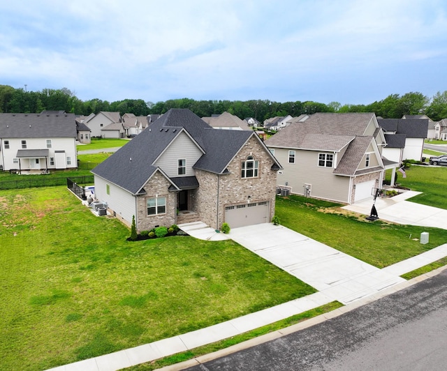 1103 Chagford Dr, Clarksville, TN 37043 - view of front of home with a garage, concrete driveway, a residential view, and brick siding