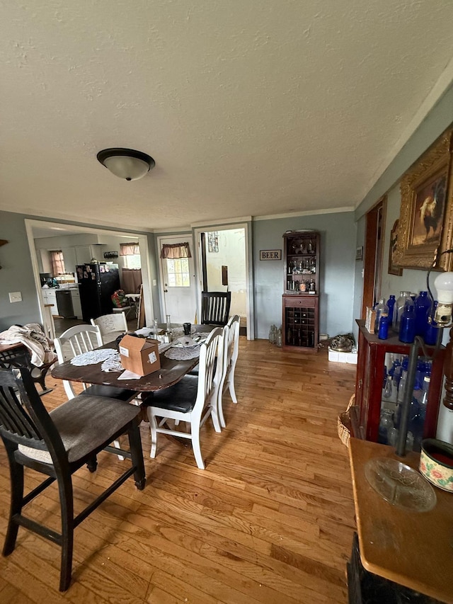 41 Park Dr, Beechmont, KY 42323 - dining room with a textured ceiling and light wood-type flooring