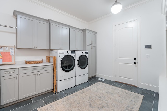 1845 Traditions Cir, Brentwood, TN 37027 - washroom featuring cabinet space, washing machine and dryer, dark tile patterned flooring, ornamental molding, and baseboards