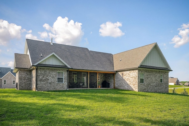 3050 Westowne Cir, Cookeville, TN 38501 - back of house featuring board and batten siding, brick siding, a yard, a shingled roof, and a sunroom