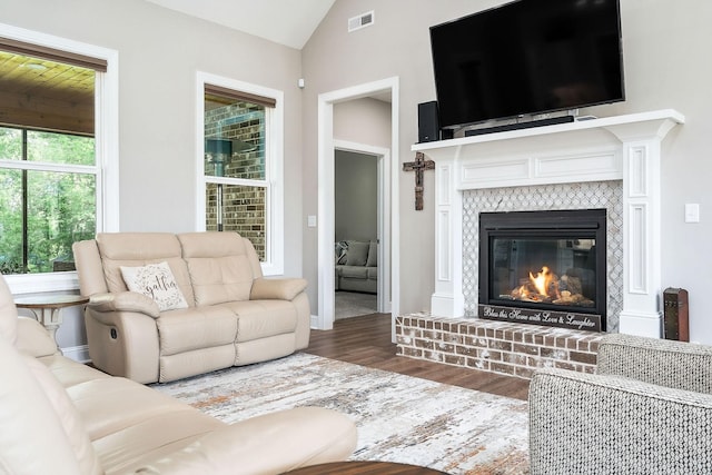 3050 Westowne Cir, Cookeville, TN 38501 - living area featuring wood finished floors, vaulted ceiling, a fireplace, and baseboards