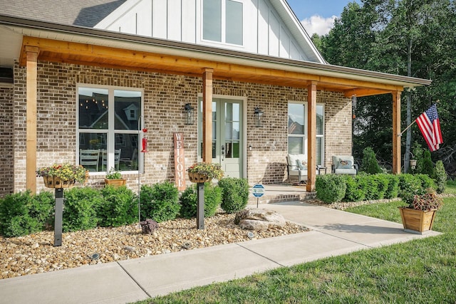 3050 Westowne Cir, Cookeville, TN 38501 - property entrance featuring board and batten siding, brick siding, and a porch