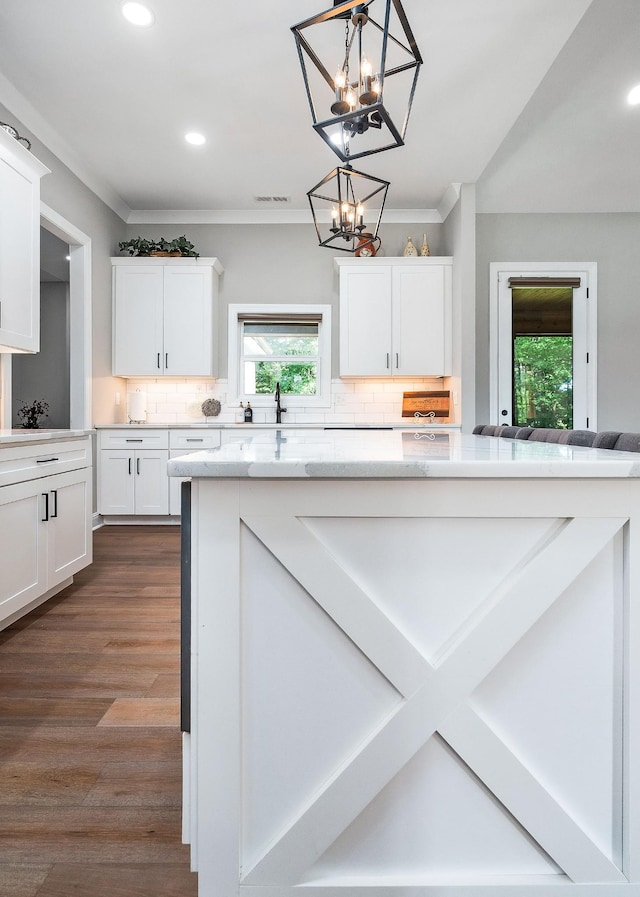 3050 Westowne Cir, Cookeville, TN 38501 - kitchen with crown molding, decorative backsplash, white cabinets, a chandelier, and recessed lighting
