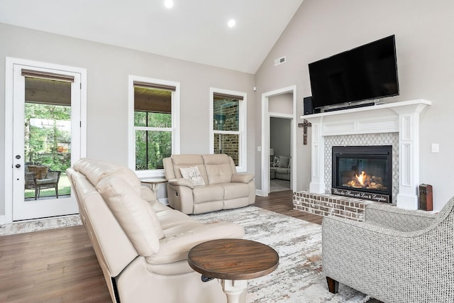 3050 Westowne Cir, Cookeville, TN 38501 - living area featuring wood finished floors, a tiled fireplace, high vaulted ceiling, recessed lighting, and baseboards