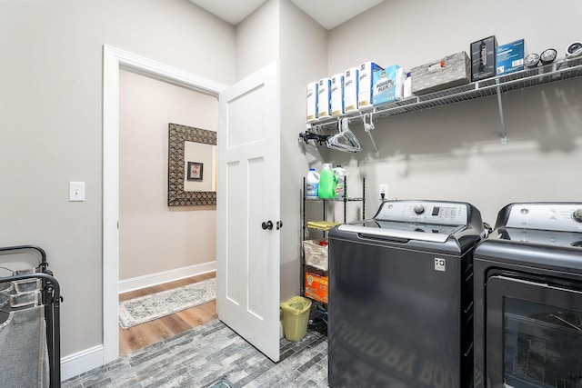 3050 Westowne Cir, Cookeville, TN 38501 - laundry room with washer and clothes dryer, wood finished floors, and baseboards