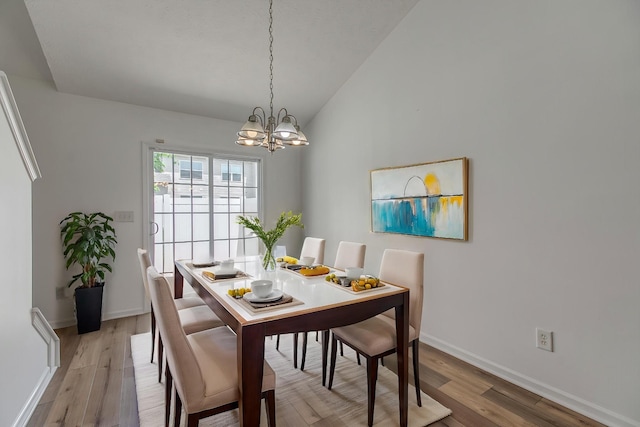 2026 Caladonia Way, Smyrna, TN 37167 - dining space featuring a chandelier, vaulted ceiling, wood finished floors, and baseboards