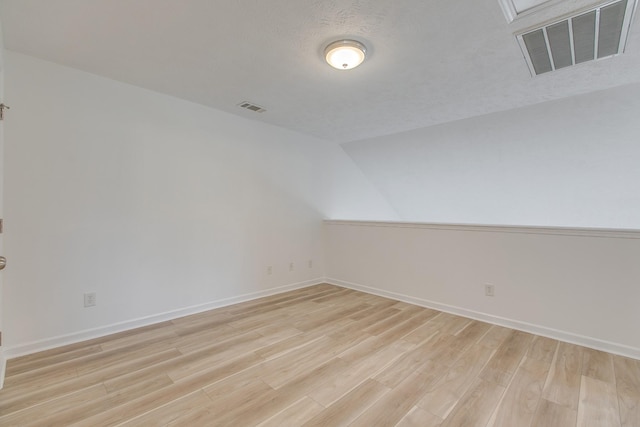 2026 Caladonia Way, Smyrna, TN 37167 - spare room featuring light wood-style floors, baseboards, and lofted ceiling