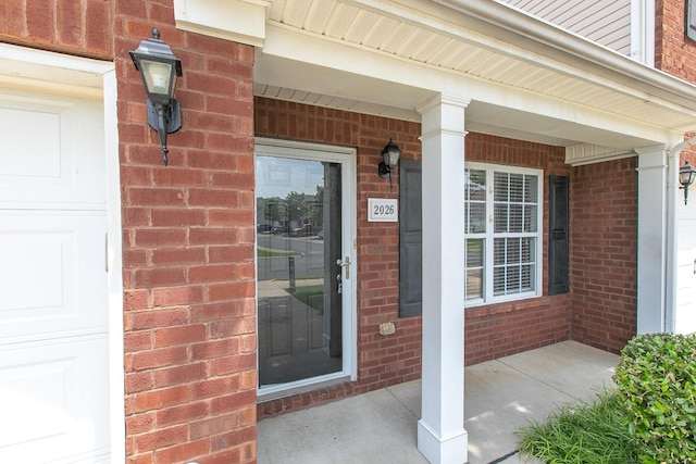 2026 Caladonia Way, Smyrna, TN 37167 - view of exterior entry featuring a porch and brick siding