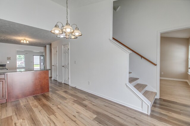 2026 Caladonia Way, Smyrna, TN 37167 - interior space featuring light wood finished floors, a chandelier, stairway, and baseboards