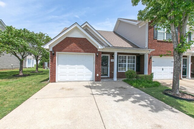 2026 Caladonia Way, Smyrna, TN 37167 - view of front of property with brick siding, driveway, a front lawn, and a garage