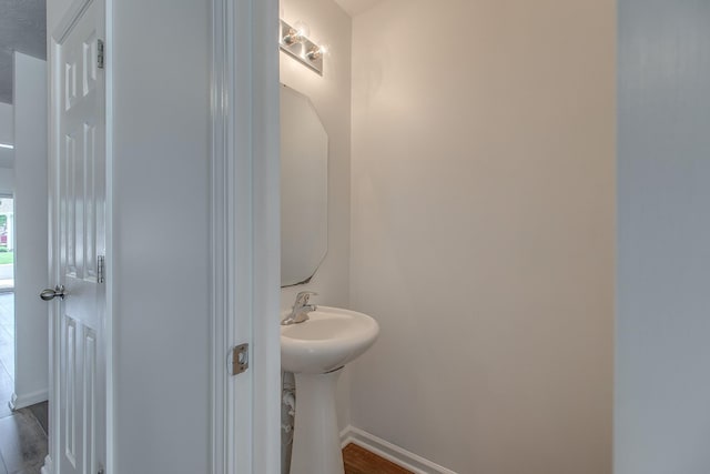 2026 Caladonia Way, Smyrna, TN 37167 - bathroom featuring baseboards and wood finished floors