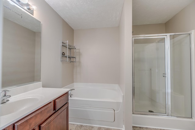 2026 Caladonia Way, Smyrna, TN 37167 - bathroom with a stall shower, a garden tub, a textured ceiling, and vanity